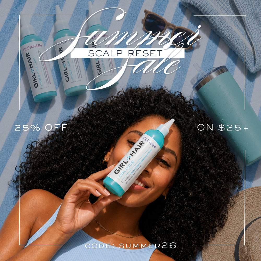 A woman with curly dark hair lies on a blue-and-white striped blanket while holding a bottle of GIRL+HAIR Scalp Reset. Other bottles, sunglasses, a tumbler, and a hat are arranged around her with promotional text reading 'Summer Scalp Reset,' '25% OFF,' 'ON $25+,' and 'CODE: SUMMER26.